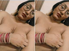 Indian brunette with glasses slowly takes of her lingerie and touches tits