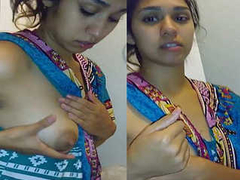 Beautiful and sexy Desi girl pressing her soft boobs and keeping her saree XXX