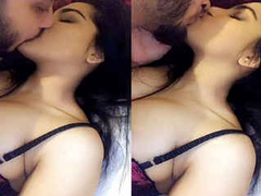 Romantic Desi lovers are making out in the bedroom while filming something XXX